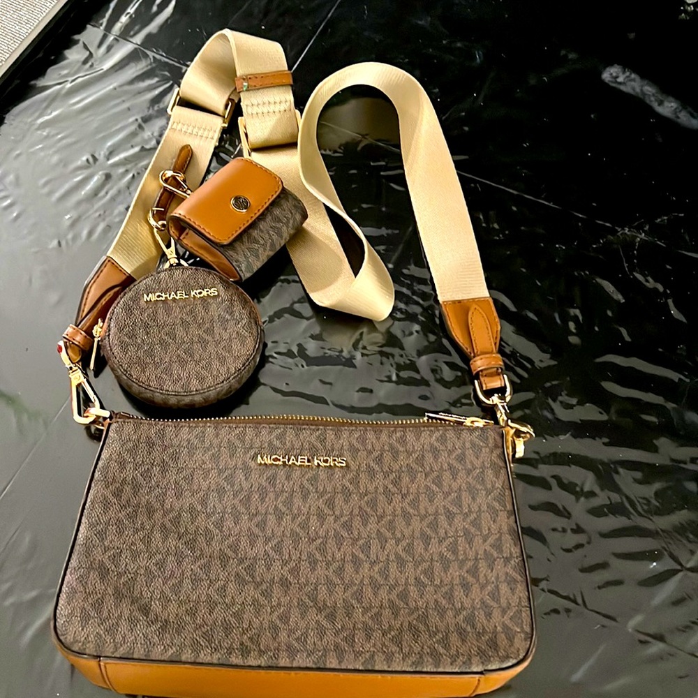 MK used cross cross bag with extra little bags hanging on strap